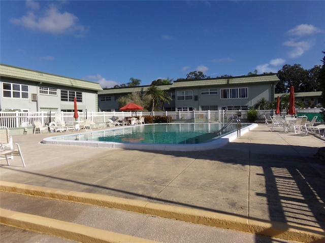 view of swimming pool with a patio area