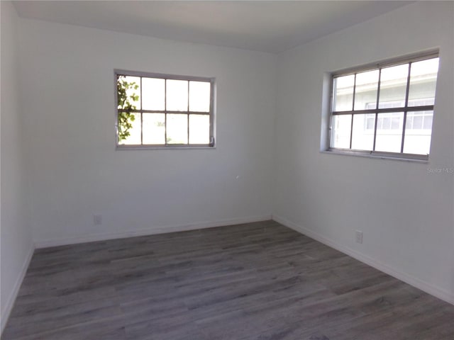 spare room featuring dark hardwood / wood-style floors