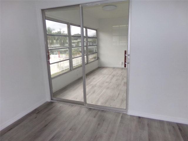 interior space with hardwood / wood-style flooring and plenty of natural light