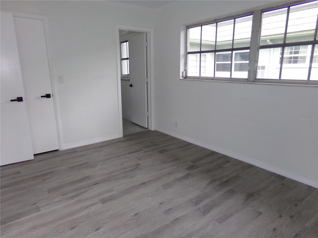 unfurnished bedroom with wood-type flooring