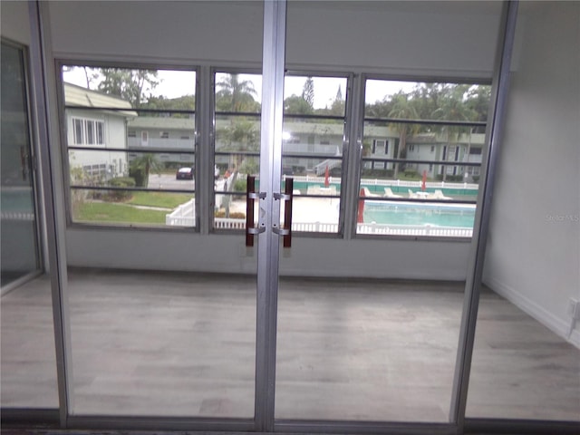 interior space featuring a wealth of natural light and hardwood / wood-style flooring