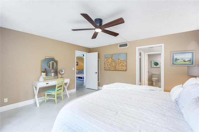 3100 SE Pruitt Rd Unit B102, Port Saint Lucie, FL 34952 - bedroom featuring baseboards, a ceiling fan, ensuite bath, and visible vents