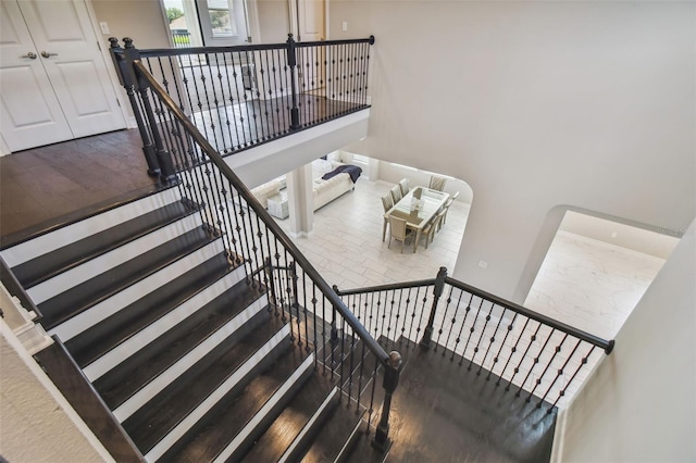 staircase featuring hardwood / wood-style flooring