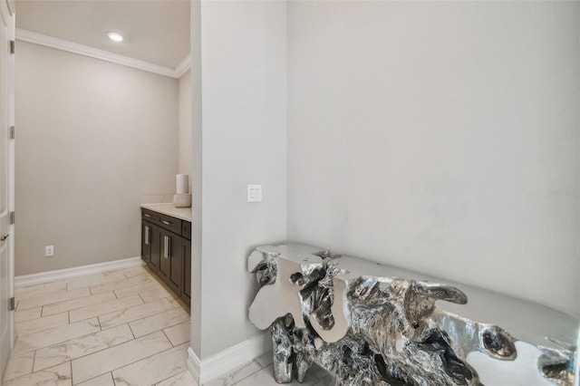 bathroom with vanity and ornamental molding