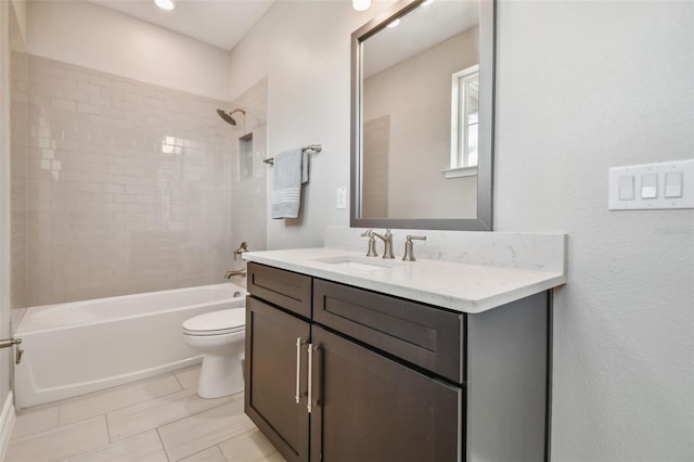 full bathroom featuring vanity, toilet, and tiled shower / bath