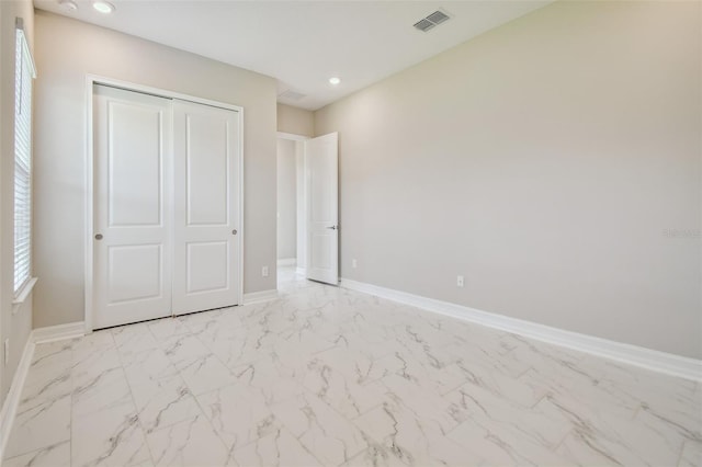 unfurnished bedroom featuring a closet