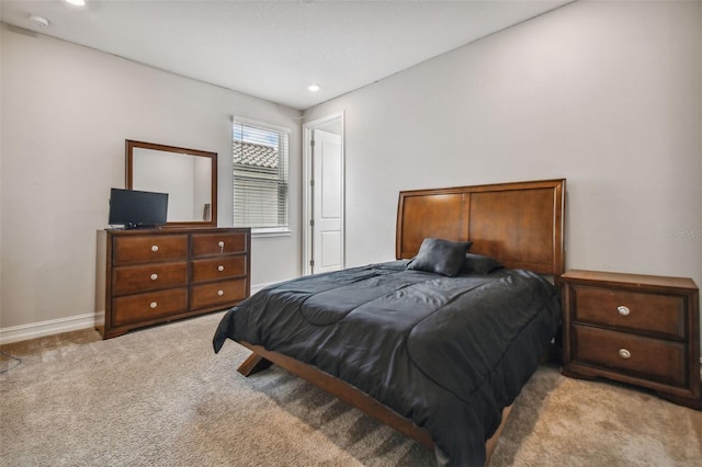 bedroom with light carpet