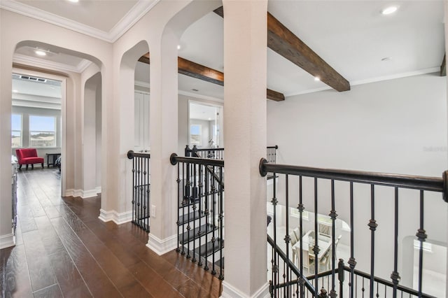 hall featuring ornamental molding, dark wood-type flooring, and beamed ceiling