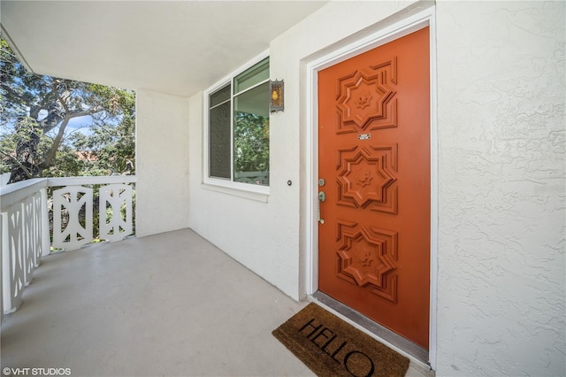 2630 Pearce Dr Unit 404, Clearwater, FL 33764 - doorway to property featuring stucco siding
