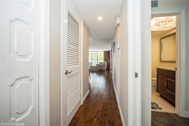2630 Pearce Dr Unit 404, Clearwater, FL 33764 - hallway featuring visible vents, recessed lighting, dark wood-type flooring, and baseboards