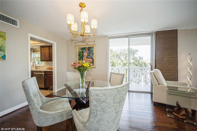 2630 Pearce Dr Unit 404, Clearwater, FL 33764 - dining space featuring a wall of windows, baseboards, visible vents, an inviting chandelier, and dark wood-type flooring