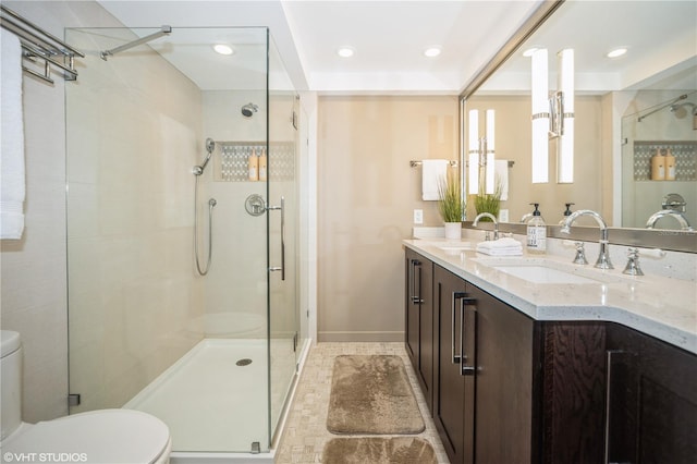 bathroom with an enclosed shower, tile patterned flooring, toilet, and vanity