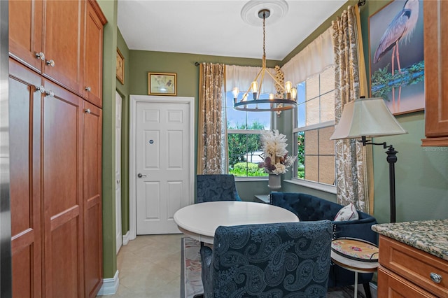 interior space featuring vanity, a chandelier, and tile patterned floors