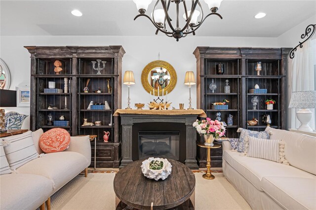 carpeted living room featuring a chandelier