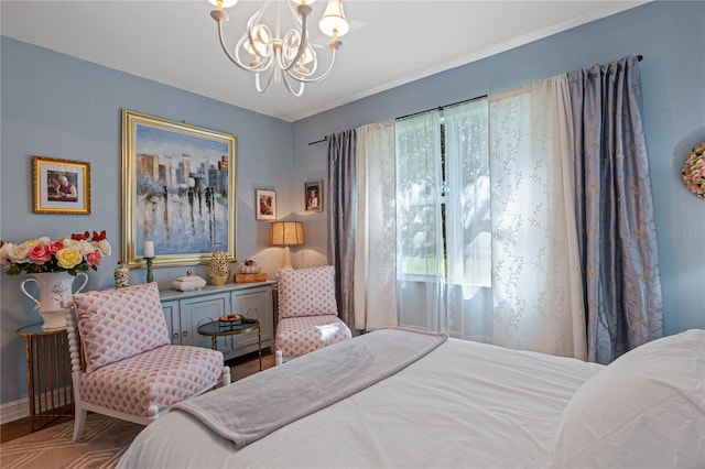 bedroom featuring a chandelier and wood-type flooring