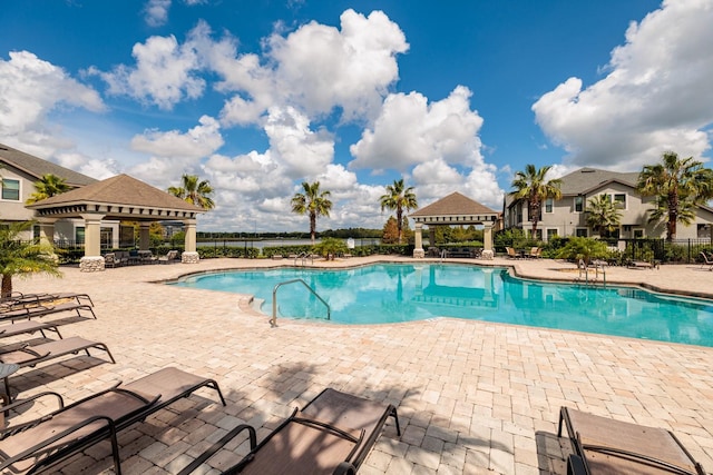 view of pool with a patio area and a gazebo