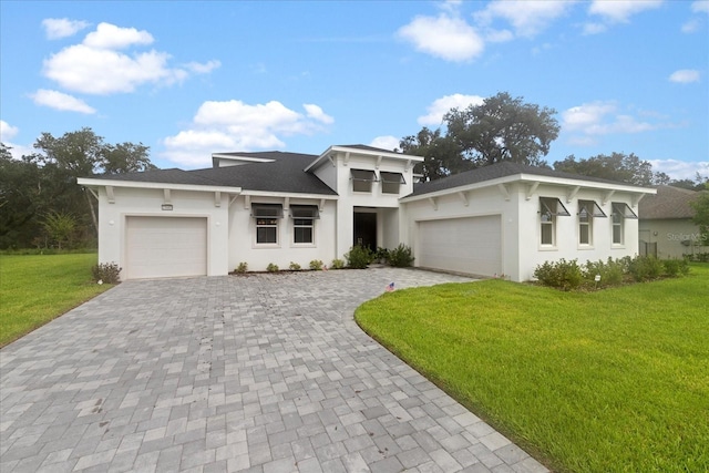 view of front of house featuring a garage and a front yard