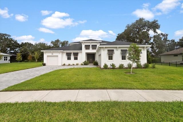 prairie-style house with a garage and a front yard