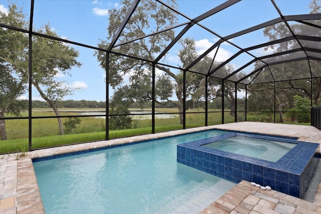 view of pool with an in ground hot tub, a lanai, and a patio