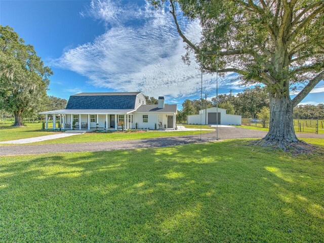 view of front of home with a front lawn and covered porch