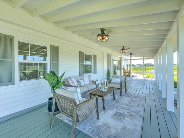 wooden terrace with outdoor lounge area and a porch