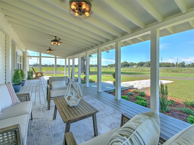 exterior space with ceiling fan and an outdoor hangout area