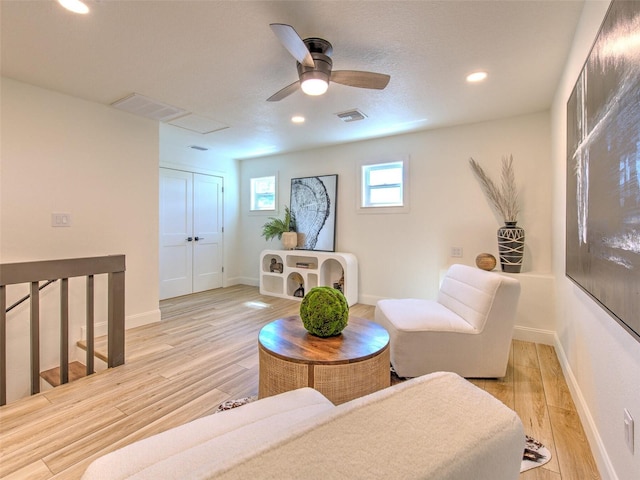 interior space with ceiling fan and light hardwood / wood-style flooring