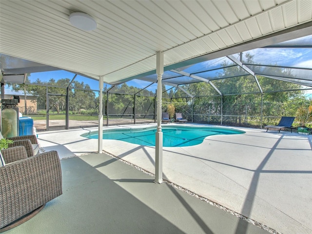 view of swimming pool featuring a lanai and a patio area