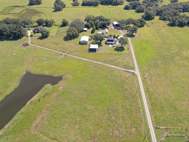 aerial view with a water view and a rural view