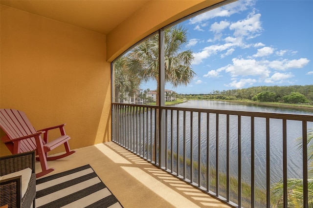 balcony featuring a water view