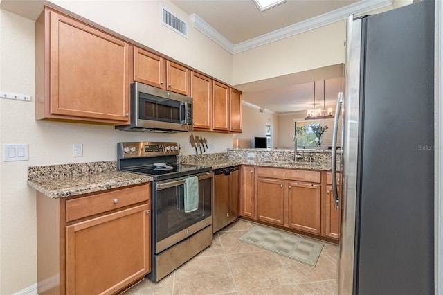 kitchen featuring visible vents, light stone countertops, ornamental molding, stainless steel appliances, and a sink