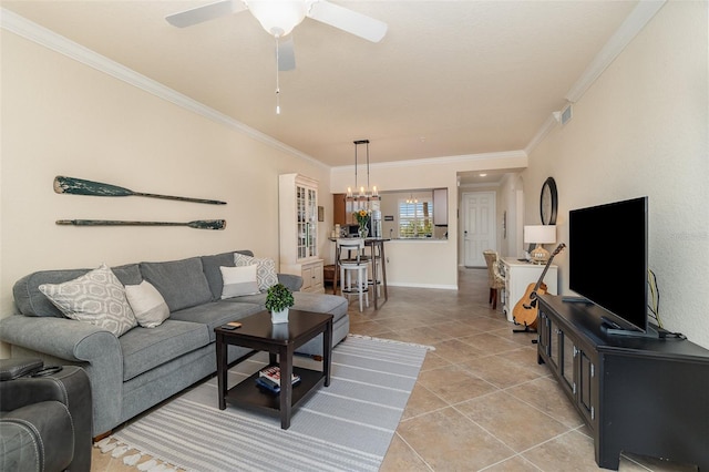 living room with light tile patterned floors, visible vents, ceiling fan with notable chandelier, and crown molding