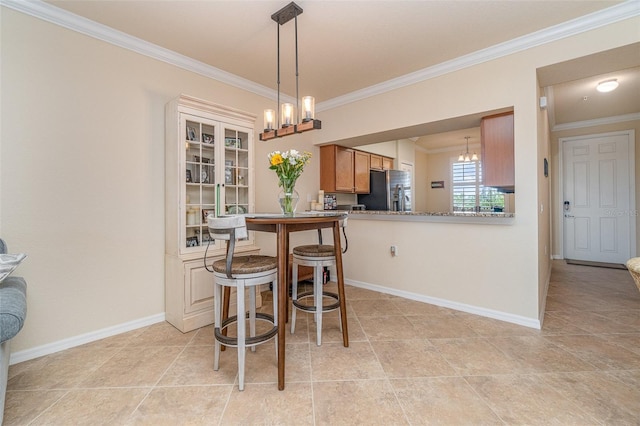 dining area featuring light tile patterned floors, baseboards, a notable chandelier, and crown molding