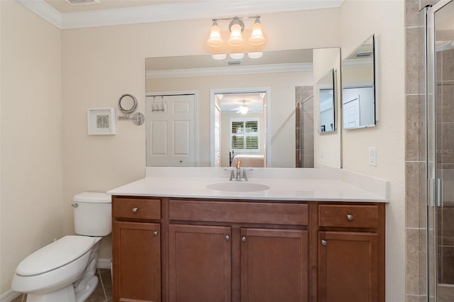 ensuite bathroom featuring crown molding, toilet, vanity, tiled shower, and ensuite bath