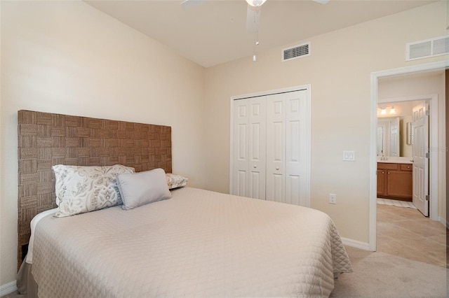 bedroom featuring light colored carpet, visible vents, a closet, and baseboards