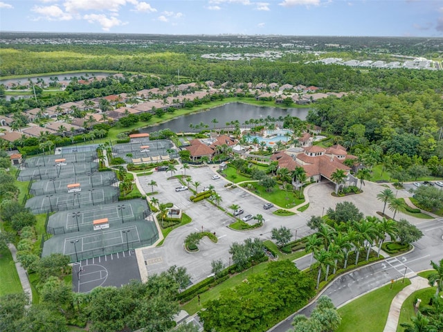 birds eye view of property with a residential view and a water view