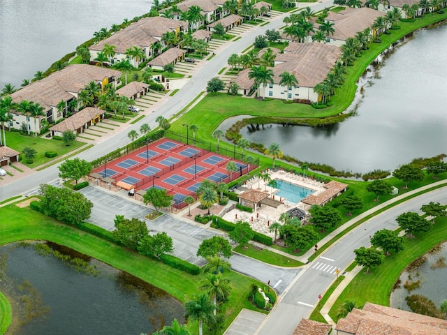 birds eye view of property featuring a water view and a residential view