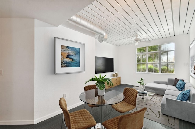 interior space with wooden ceiling, baseboards, and wood finished floors