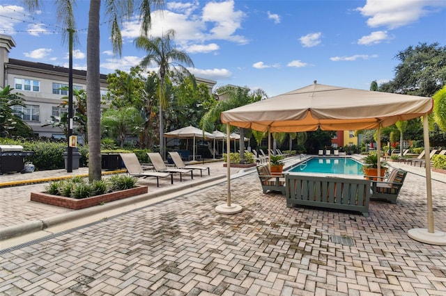 view of community featuring a patio and a swimming pool