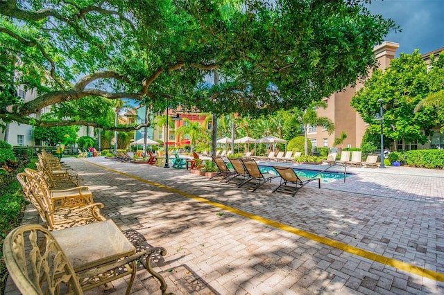 exterior space with a patio and a pool