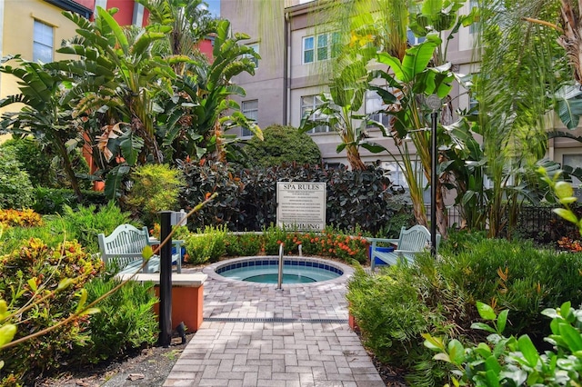 exterior space featuring a jacuzzi