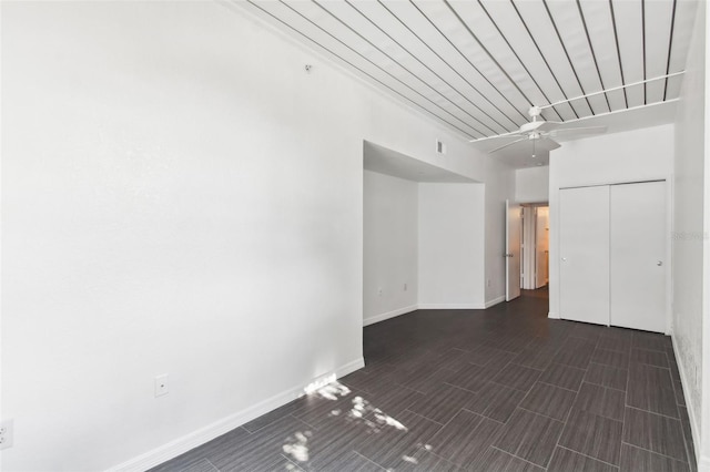 empty room with visible vents, baseboards, and a ceiling fan