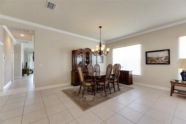 dining area with a chandelier, light tile patterned floors, a wealth of natural light, and crown molding