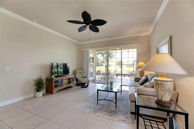 tiled living room with ceiling fan and crown molding