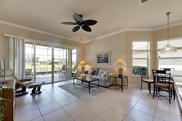 tiled living room with ceiling fan and crown molding