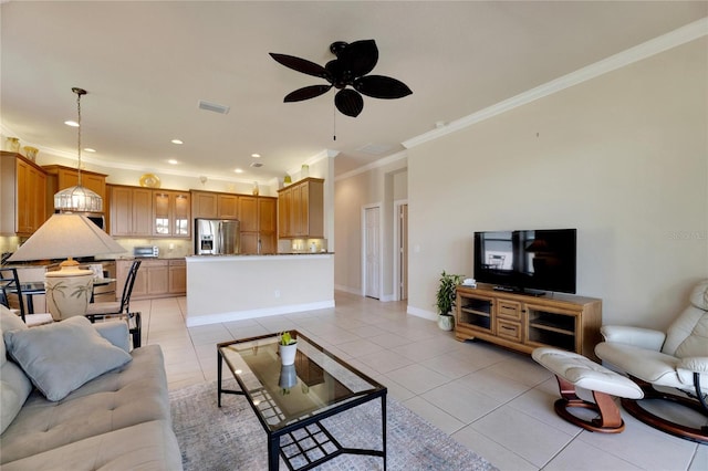 tiled living room featuring ceiling fan and ornamental molding