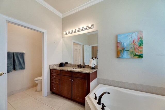 bathroom featuring vanity, crown molding, tile patterned flooring, toilet, and a tub