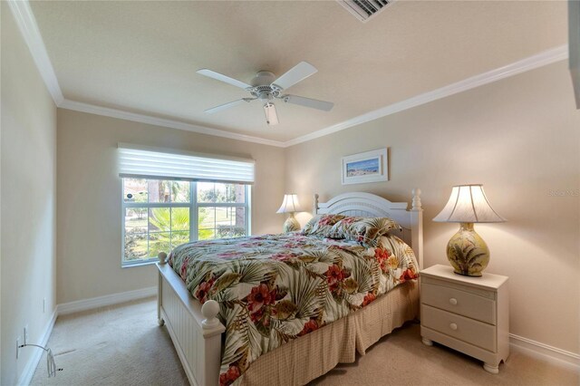 bedroom with ceiling fan, light carpet, and ornamental molding