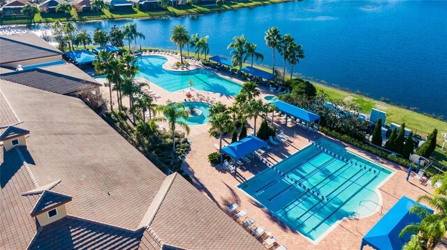 birds eye view of property with a water view