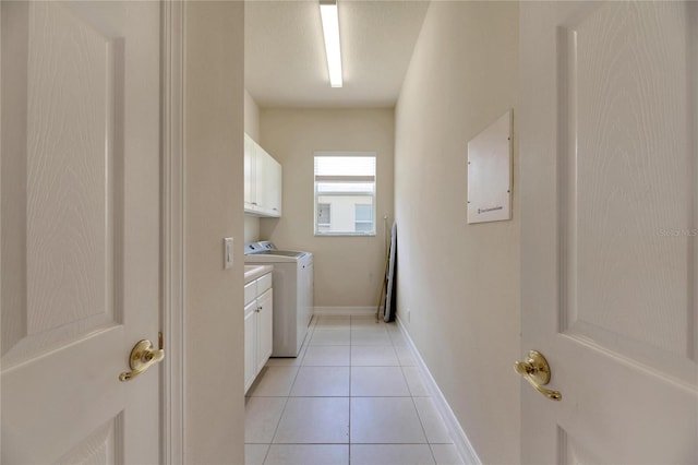 laundry room with cabinets, light tile patterned floors, electric panel, and washer and dryer